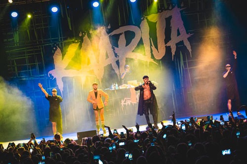 Image of a Finnish artist called Käärijä and background singers with 10 x 6 meter (32.8 ft x 19.7 ft) size backdrop in the background