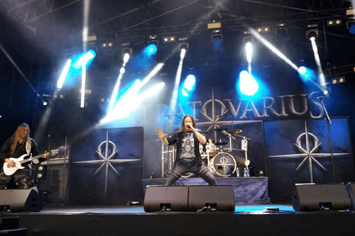 Image of a Finnish band called Stratovarius with their 10 x 4 meter (32.8 x 13 ft) size backdrop in the background