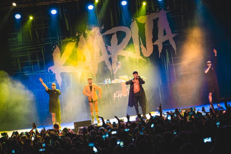 Image of a Finnish artist called Käärijä and background singers with 10 x 6 meter (32.8 ft x 19.7 ft) size backdrop in the background