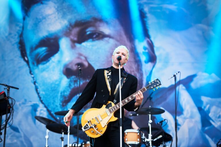 Image of a Finnish band called Olavi Uusivirta with backdrop in the background